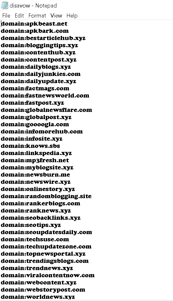 Real Google disavow file example showing domain: syntax and comment lines for toxic guest post backlinks